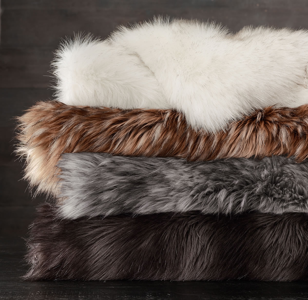 Restoration Hardware&#039;s oversized faux fur throws mimic Siberian red and gray fox.