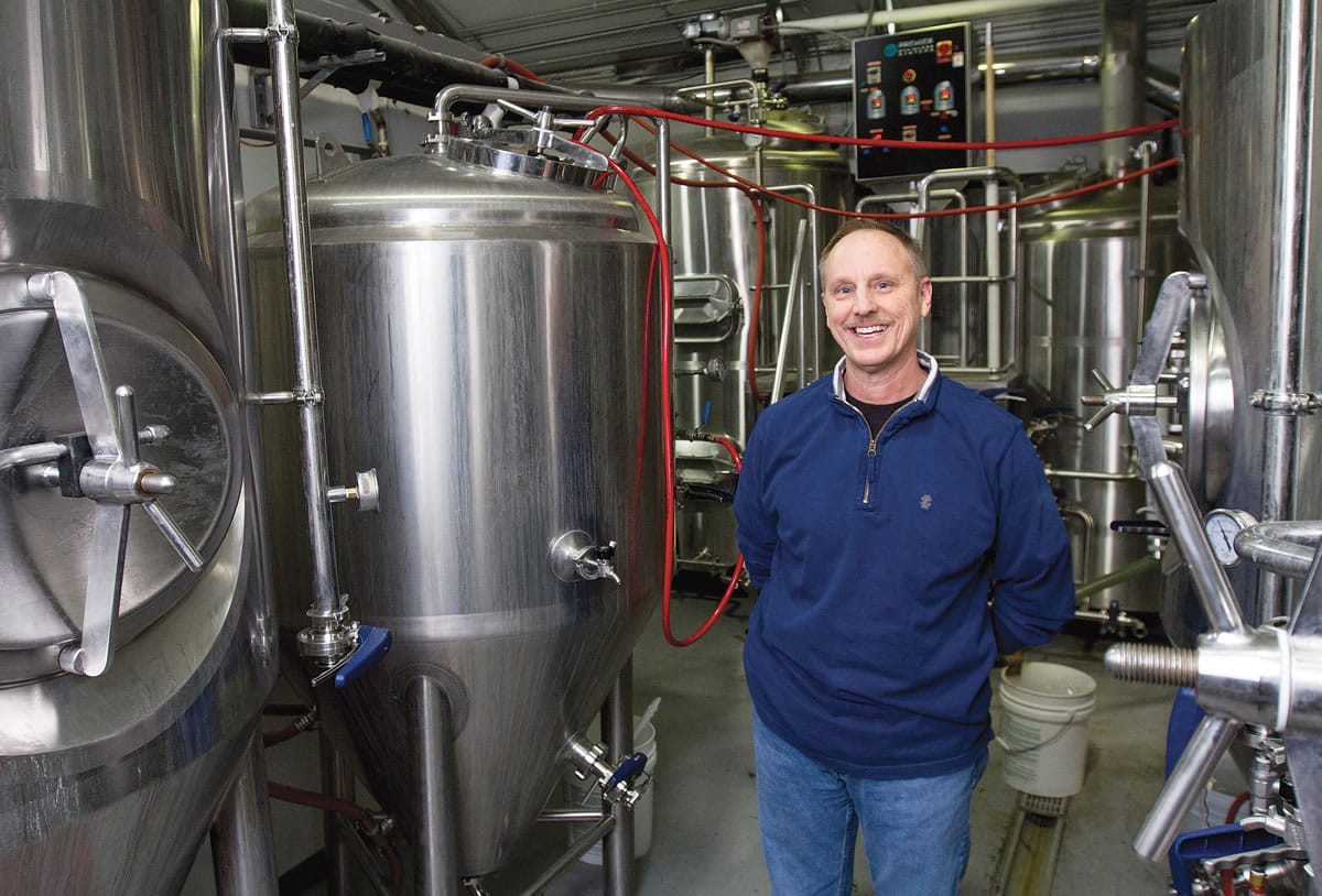 Mike Sutherland, brewmaster and owner of White Bluffs Brewing in Richland,  contracts two years ahead for the aroma hops he needs for his beers.