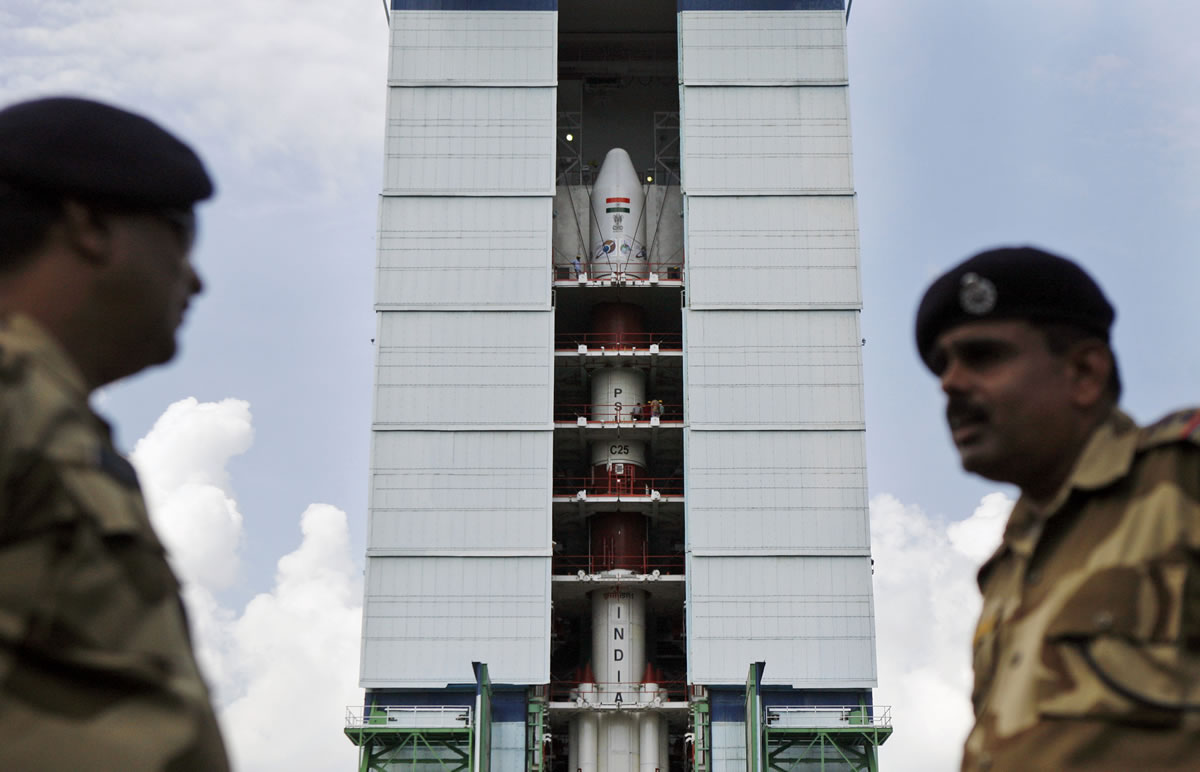 Central Industrial Security Force personnel stand guard near the Polar Satellite Launch Vehicle  at the Satish Dhawan Space Center at Sriharikota, in the southern Indian state of Andhra Pradesh on Oct. 30.