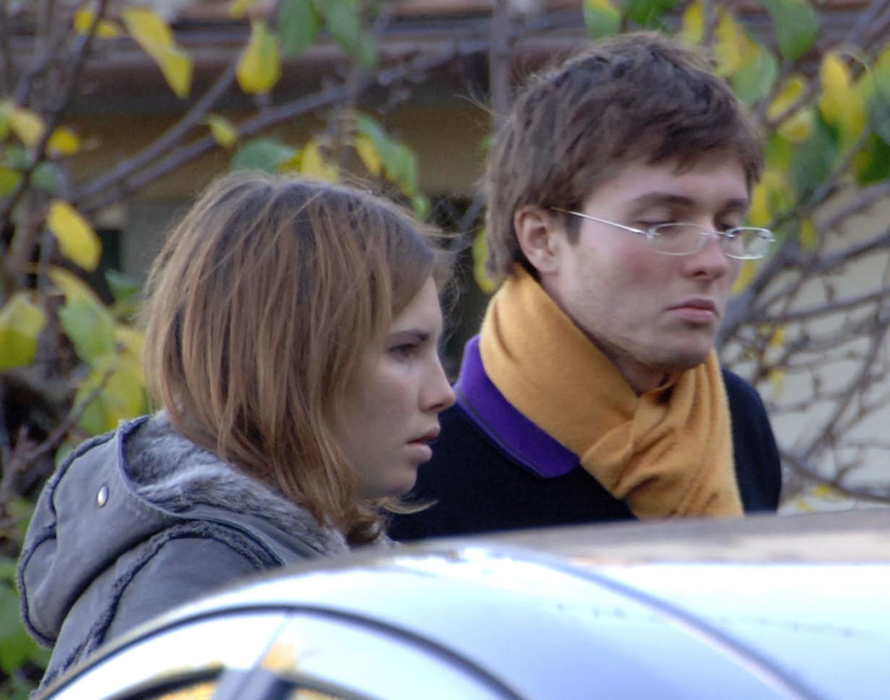 American exchange student Amanda Knox, left, and her Italian boyfriend, Raffaele Sollecito, outside the rented house where 21-year-old British student Meredith Kercher was found dead in Perugia, Italy, on Nov.