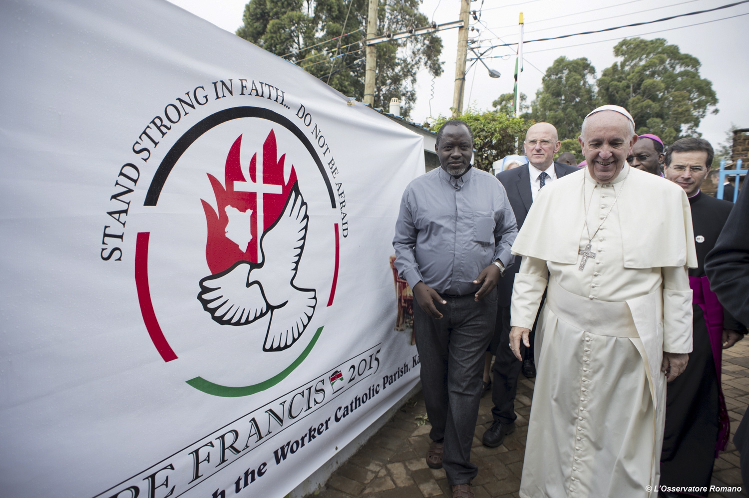 Pope Francis arrives Friday for his visit to Kangemi, one of the 11 slums dotting Nairobi, Kenya. Pope Francis denounced the conditions slum-dwellers are forced to live in, saying Friday that access to safe water is a basic human right and that everyone should have dignified, adequate housing.