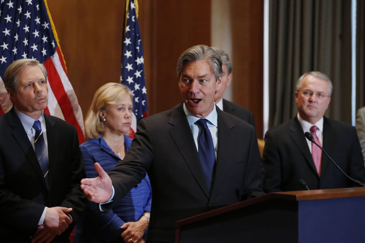 Canada's Ambassador to the US Gary Doer, center, stands with, from left, Sen. John Hoeven, D-N.D., Sen. Mary Landrieu, D-La., and American Petroleum Institute President and CEO Jack N.