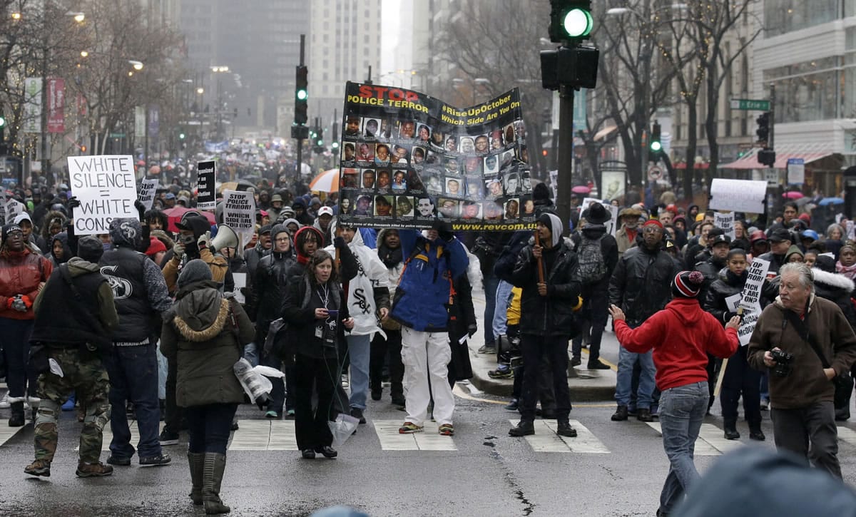 Protesters make their way up North Michigan Avenue on Friday in Chicago as community activists and labor leaders hold a demonstration billed as a &quot;march for justice&quot; in the wake of the release of video showing an officer fatally shooting Laquan McDonald. (AP Photo/Nam Y.