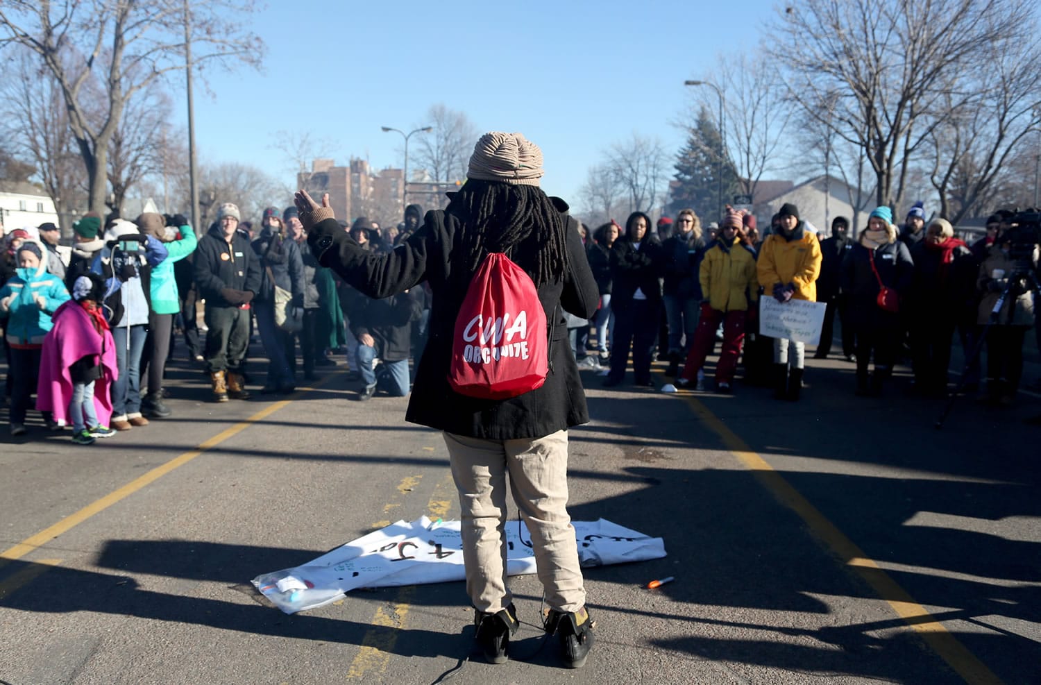 Alanna Galloway speaks to a crowd in front of a police precinct Saturday in Minneapolis.