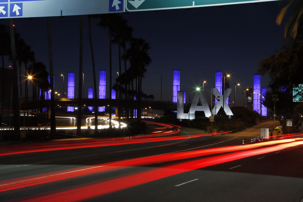 Lighted pylons at the Century Boulevard entrance to Los Angeles International Airport, which normally flash in a multicolored sequence, shine a steady blue Saturday evening in honor of Gerardo Hernandez, the Transportation Security Administration officer slain at an LAX terminal Friday. He is the first TSA officer to die in the line of duty in the history of the 12-year-old agency, created in the aftermath of the Sept.