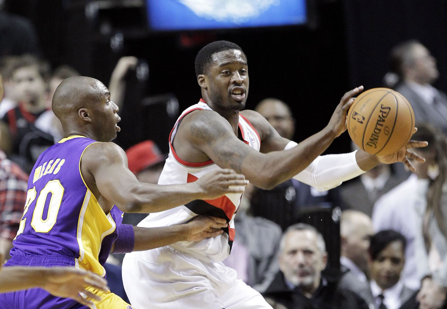 Portland Trail Blazers guard Wesley Matthews, right, passes the ball as Los Angeles Lakers guard Jodie Meeks defends during the first half of Monday's game at the Moda Center.