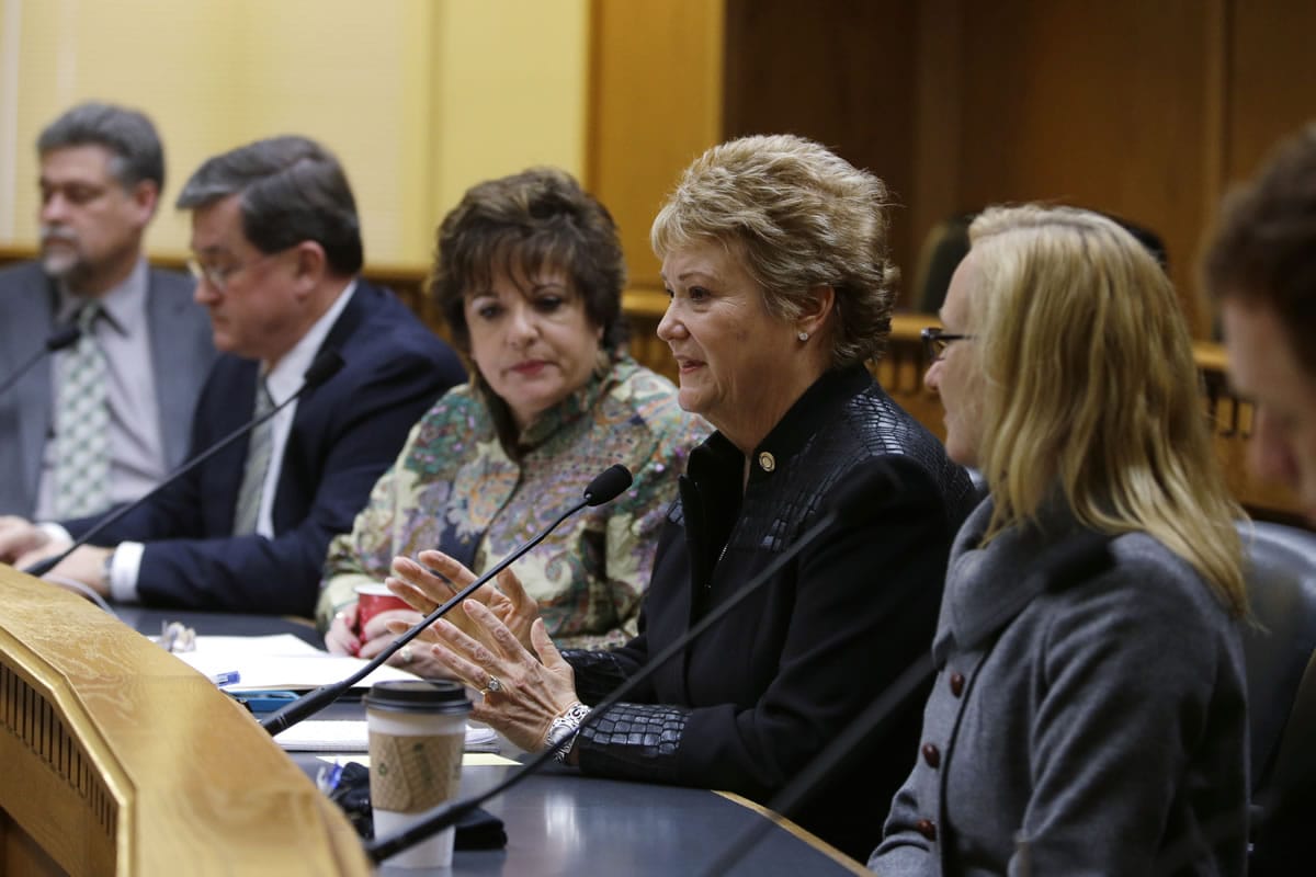 Rep. Judy Clibborn, D-Mercer Island, second from right, chair of the House Transportation Committee, talks about the upcoming legislative session on Thursday at the AP Legislative Preview in Olympia. Looking on are Secretary of Transportation Lynn Peterson, right, and Sen.