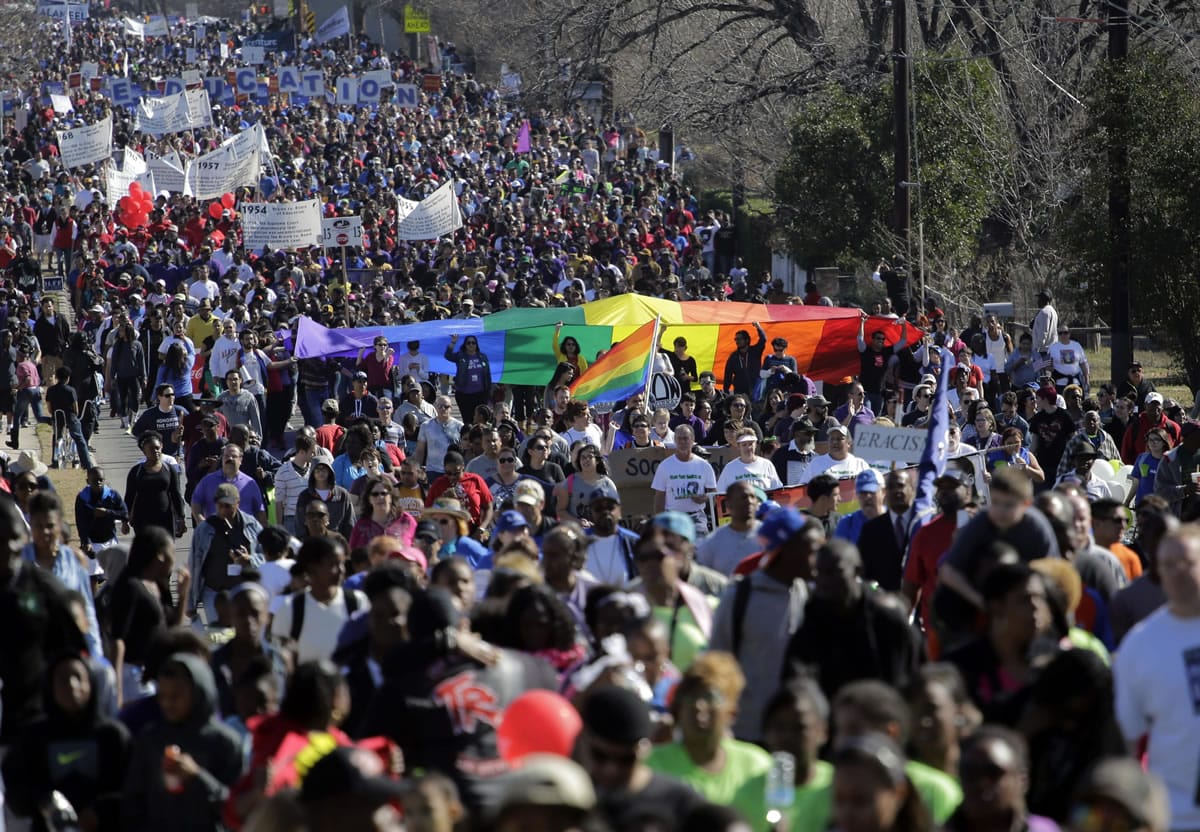 Thousands participate in a march honoring Martin Luther King Jr., on Monday in San Antonio.