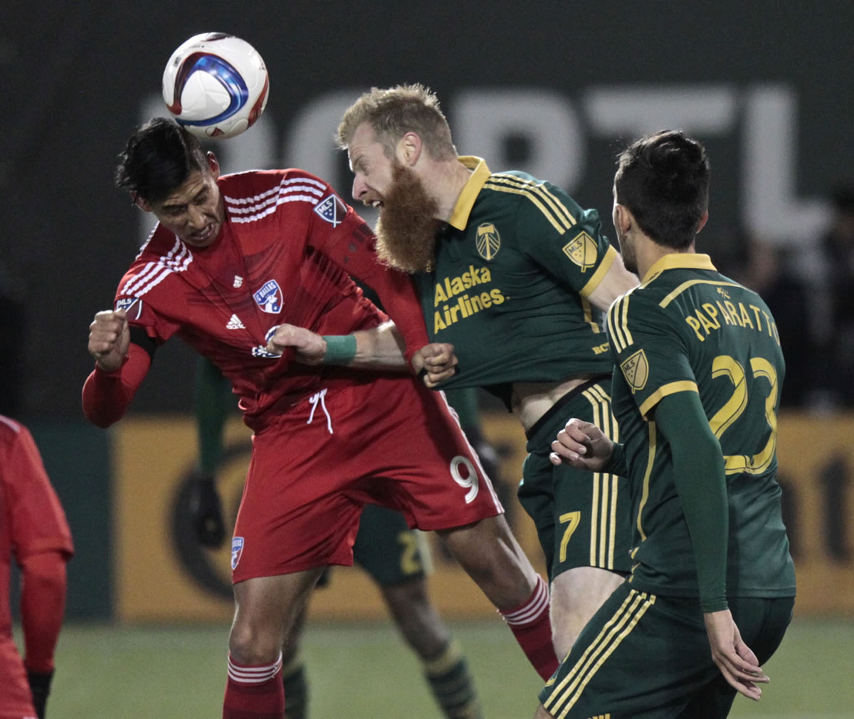Portland Timbers defender Nat Borchers (7) heads the ball next to FC Dallas forward David Texeira (9) during the second half of the first leg of the MLS soccer Western Conference championship in Portland, Ore., Sunday, Nov. 22, 2015.