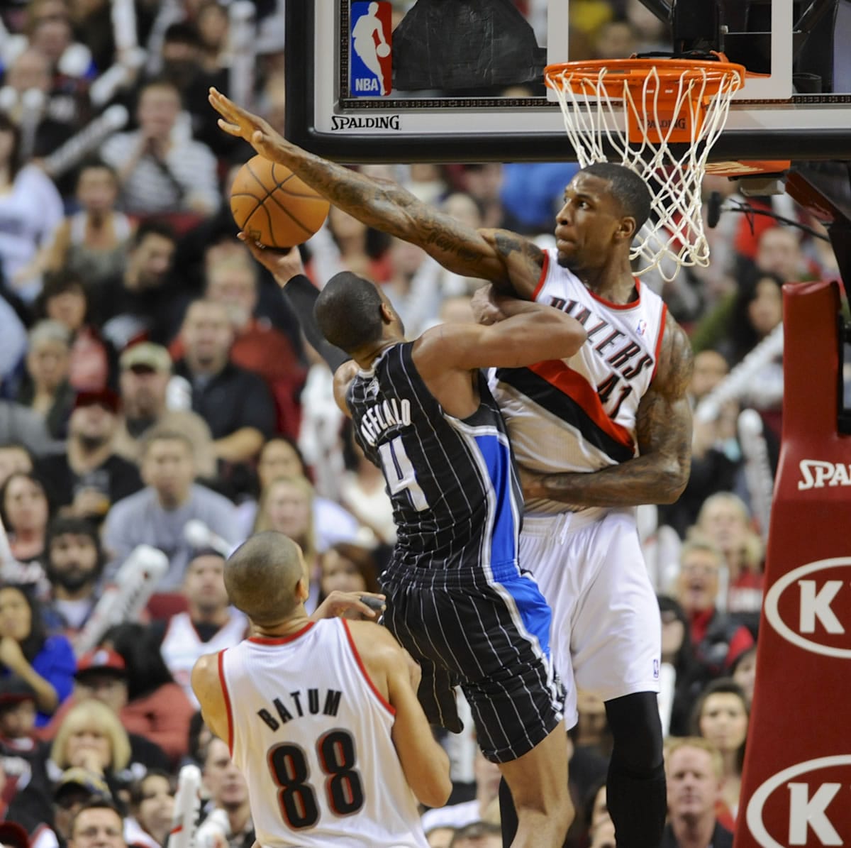 The Portland Trail Blazers' Thomas Robinson (41) defends a shot by the Orlando Magic's Arron Afflalo (4) during the second half of Wednesday's game. The Trail Blazers beat the Magic 110-94.