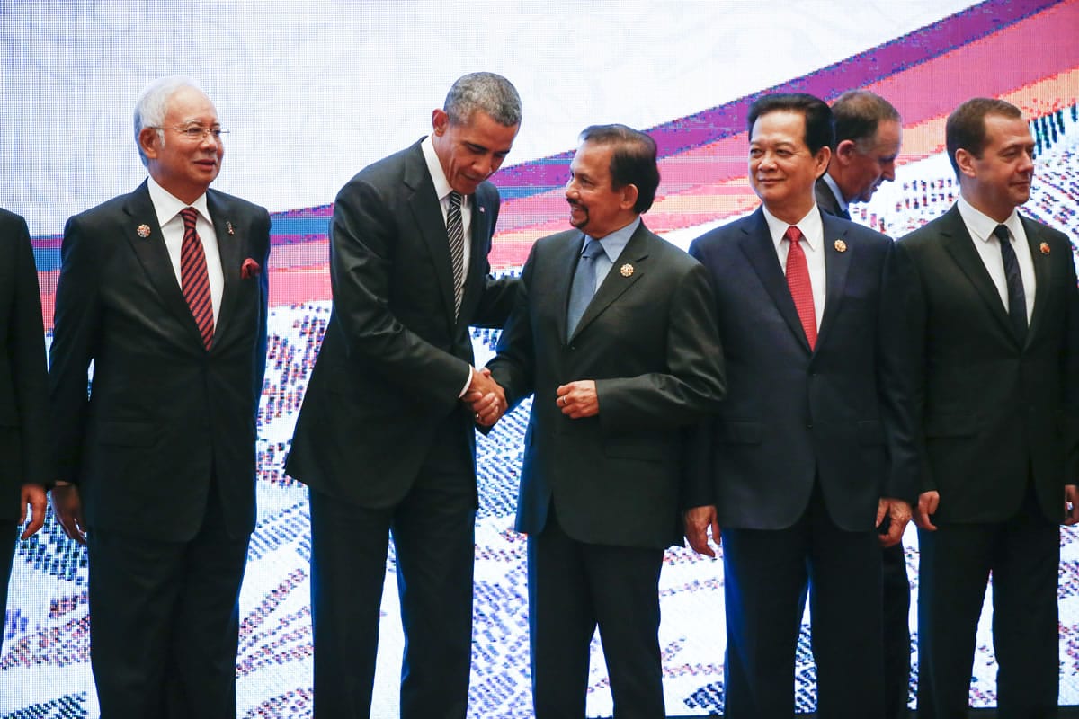 U.S. President Barack Obama, second from left, shakes hands with Sultan Hassanal Bolkiah of Brunei,  while Malaysian Prime Minister Najib Razak, left, and Vietnamese Prime Minister Nguyen Tan Dung and Russian Prime Minister Dmitry Medvedev, right, look on during the 10th East Asia Summit at the 27th ASEAN Summit in Kuala Lumpur, Malaysia, on Sunday. New Zealand Prime Minister John Key is walking behind Nguyen and Medvedev.