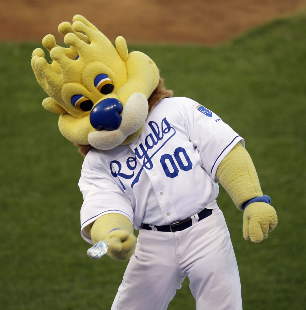 In this Monday, Aug. 24, 2009 photograph, Kansas City Royals mascot &quot;Sluggerrr&quot; throws hot dogs into the crowd during a baseball game against the Cleveland Indians in Kansas City, Mo.