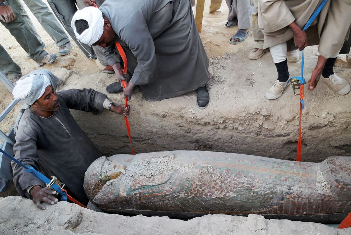 Egypt Supreme Council of Antiquities
Men dig up a preserved wooden sarcophagus in the ancient city of Luxor, Egypt. It dates back to 1600 B.C., Egypt's antiquities minister said.