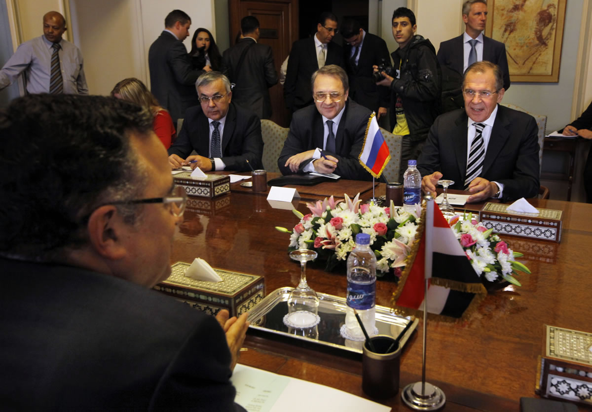 Russian foreign minister Sergei Lavrov speaks to his counterpart Nabil Fahmy, foreground, during their meeting in Cairo, Egypt, on Thursday.