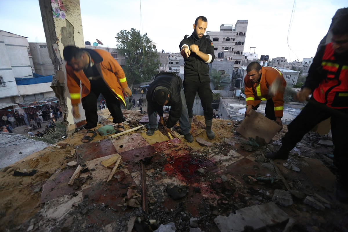 Palestinian security officers and rescue teams inspect the scene of an explosion inside apartment in Beit Hanoun, in the northern Gaza Strip on Tuesday.
