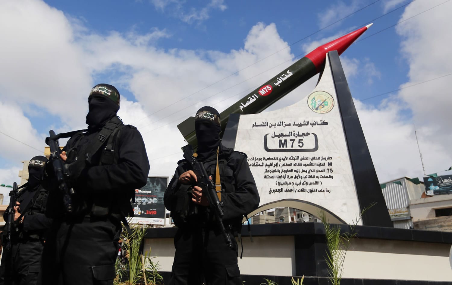 Hamas military wing members take part in a ceremony to inaugurate a monument marking the anniversary of the death of  a senior Hamas official Ibrahim Maqadama, killed in an Israeli air strike in 2003, in Gaza City on Monday.
