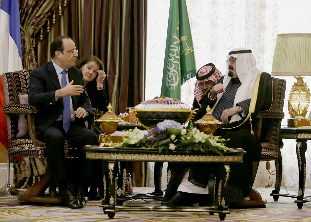 Saudi Arabia's King Abdullah, right, speaks with French President Francois Hollande during their meeting Sunday in Riyadh, Saudi Arabia.