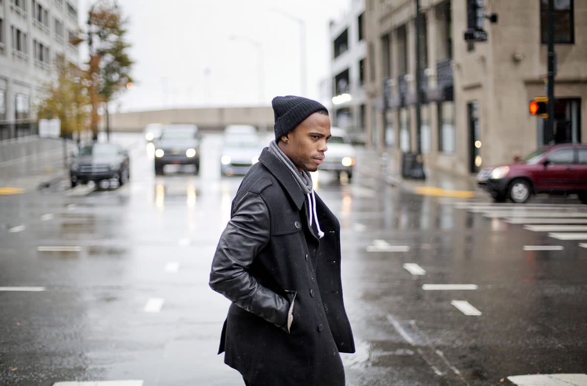 Rapper B.o.B crosses Spring Street as he leaves an interview in Atlanta.