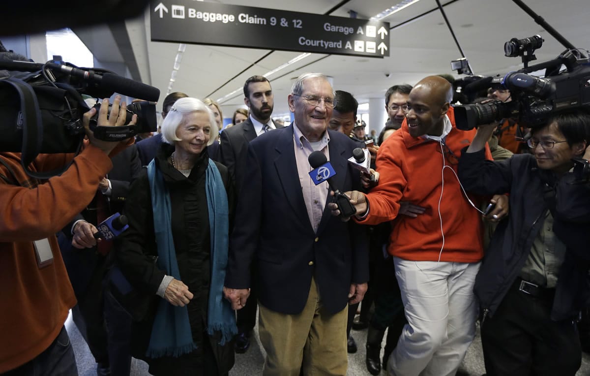 Merrill Newman speaks with reporters beside his wife Lee after arriving at San Francisco International Airport on Saturday in San Francisco.  Newman was detained in North Korea late October at the end of a 10-day trip to North Korea, a visit that came six decades after he oversaw a group of South Korean wartime guerrillas during the 1950-53 war.