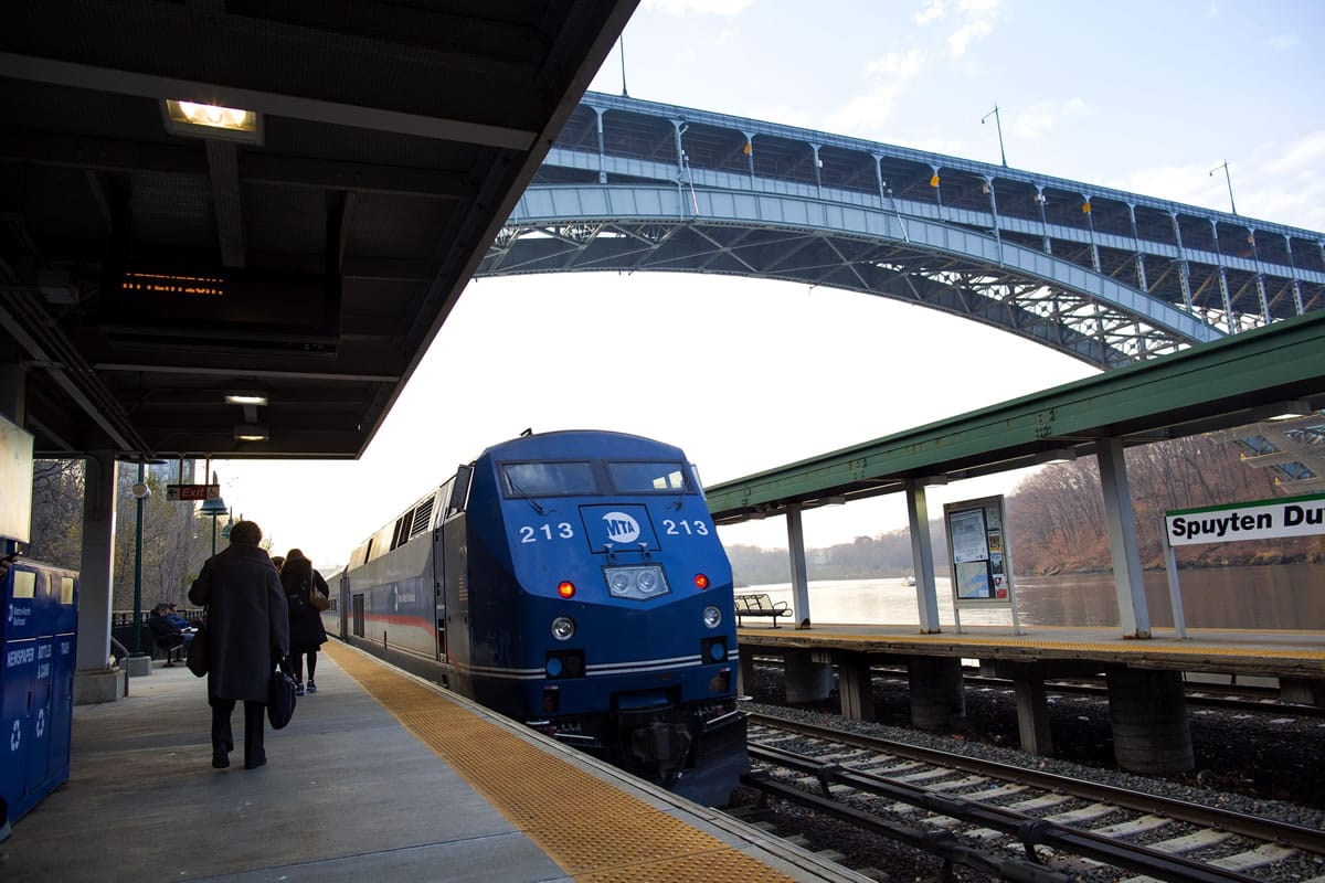 A Metro-North passenger train that is pushed by a locomotive rolls through the Spuyten Duyvil station in the Bronx borough of New York on Wednesday, not far from the area where a fatal derailment disrupted service on the Hudson Line of the railroad Sunday, Dec. 1.