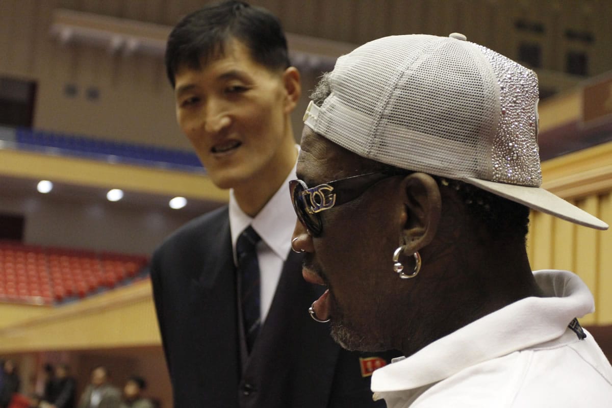 Dennis Rodman, right  meets with former North Korean basketball player Ri Myung Hun at a practice session with USA and North Korean players in Pyongyang, North Korea, on Tuesday.