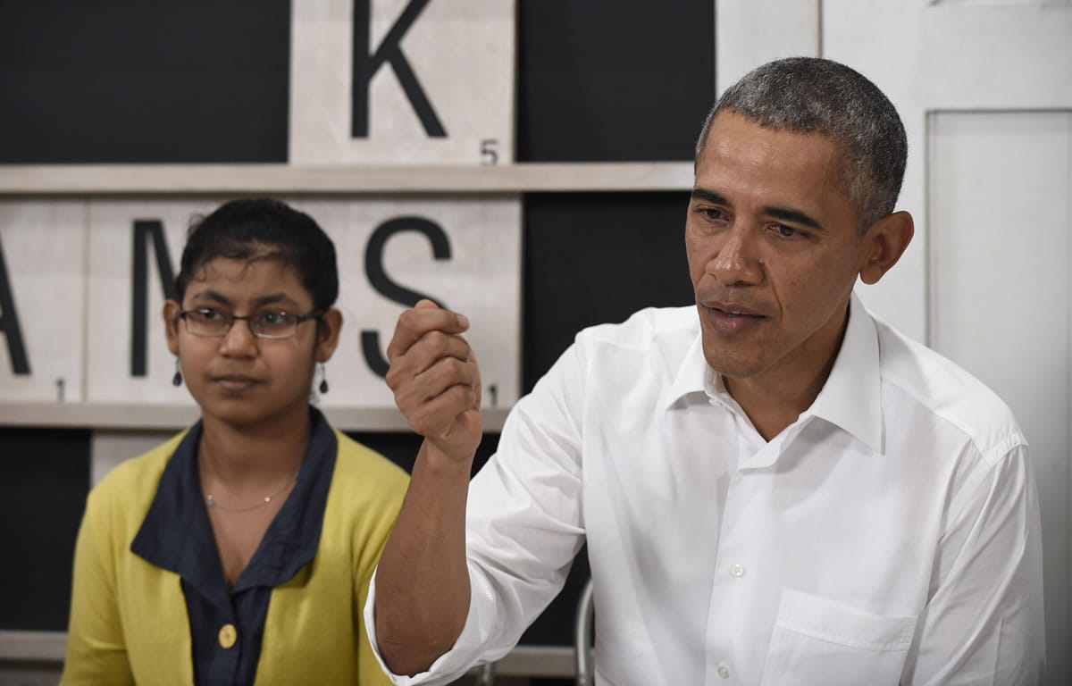 President Barack Obama, sitting next to a 16-year-old refugee from Myanmar, speaks about the refugee situation during a visit to the Dignity for Children Foundation in Kuala Lumpur, Malaysia, Saturday, Nov. 21, 2015. Obama visited the refugee center in Malaysia, casting a spotlight on the plight of those fleeing violence and persecution from Myanmar to Syria.