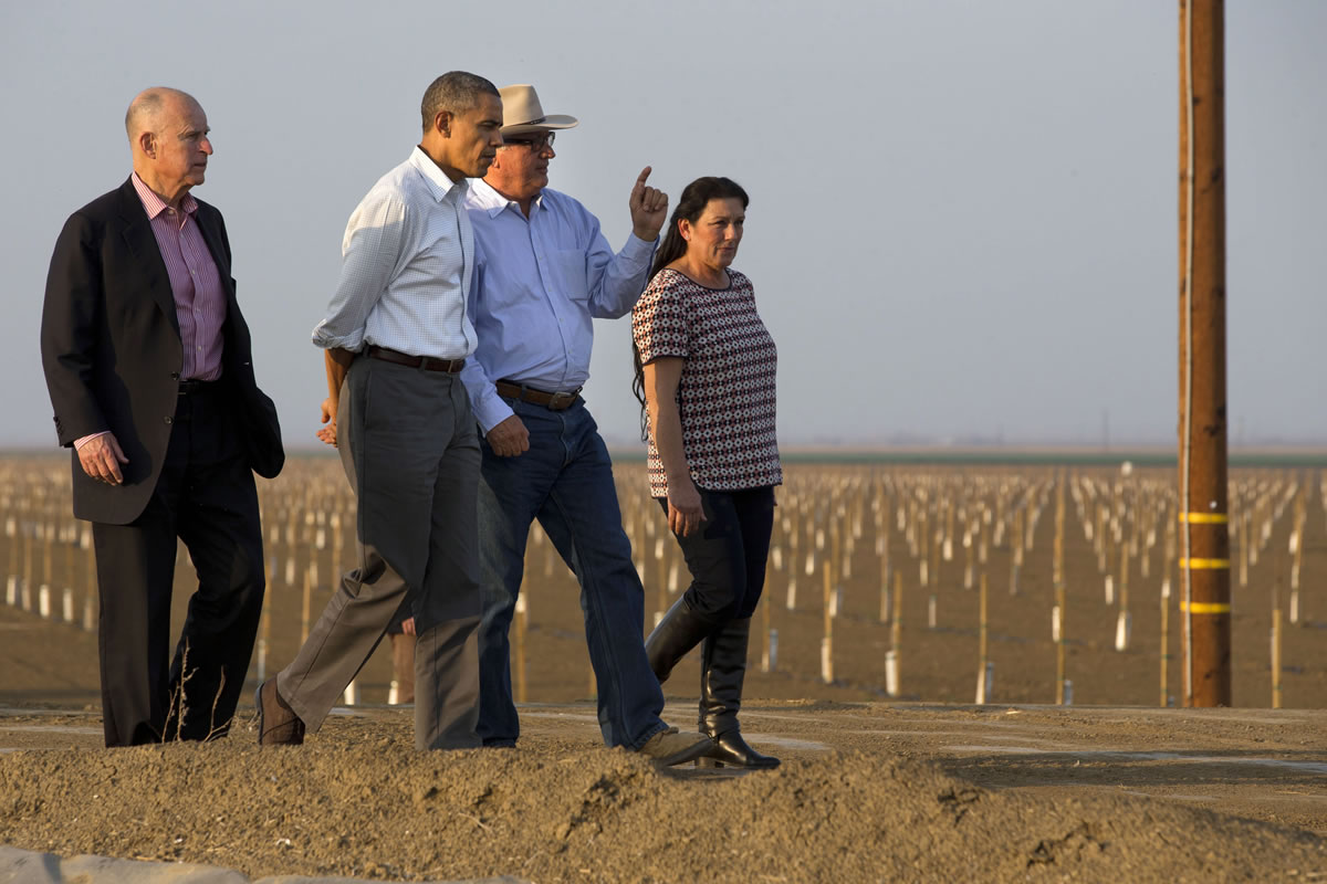 President Barack Obama tours a farm with California Gov.