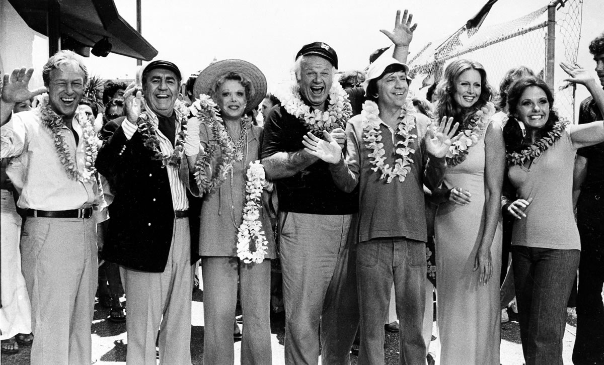 The cast of &quot;Gilligan's Island,&quot; from left, Russell Johnson, as the professor; Jim Backus as Thurston Howell III; Natalie Schafer, as Mrs. Howell III; Alan Hale Jr., as the skipper; Bob Denver, as Gilligan; Judith Baldwin replacing original cast member Tina Louise, as Ginger, and Dawn Wells, as Mary Ann, posing during filming of a two-hour reunion show, &quot;The Return from Gilligan's Island,&quot; in Los Angeles on Oct. 2, 1978. Johnson died Thursday at his home on Bainbridge Island of natural causes.