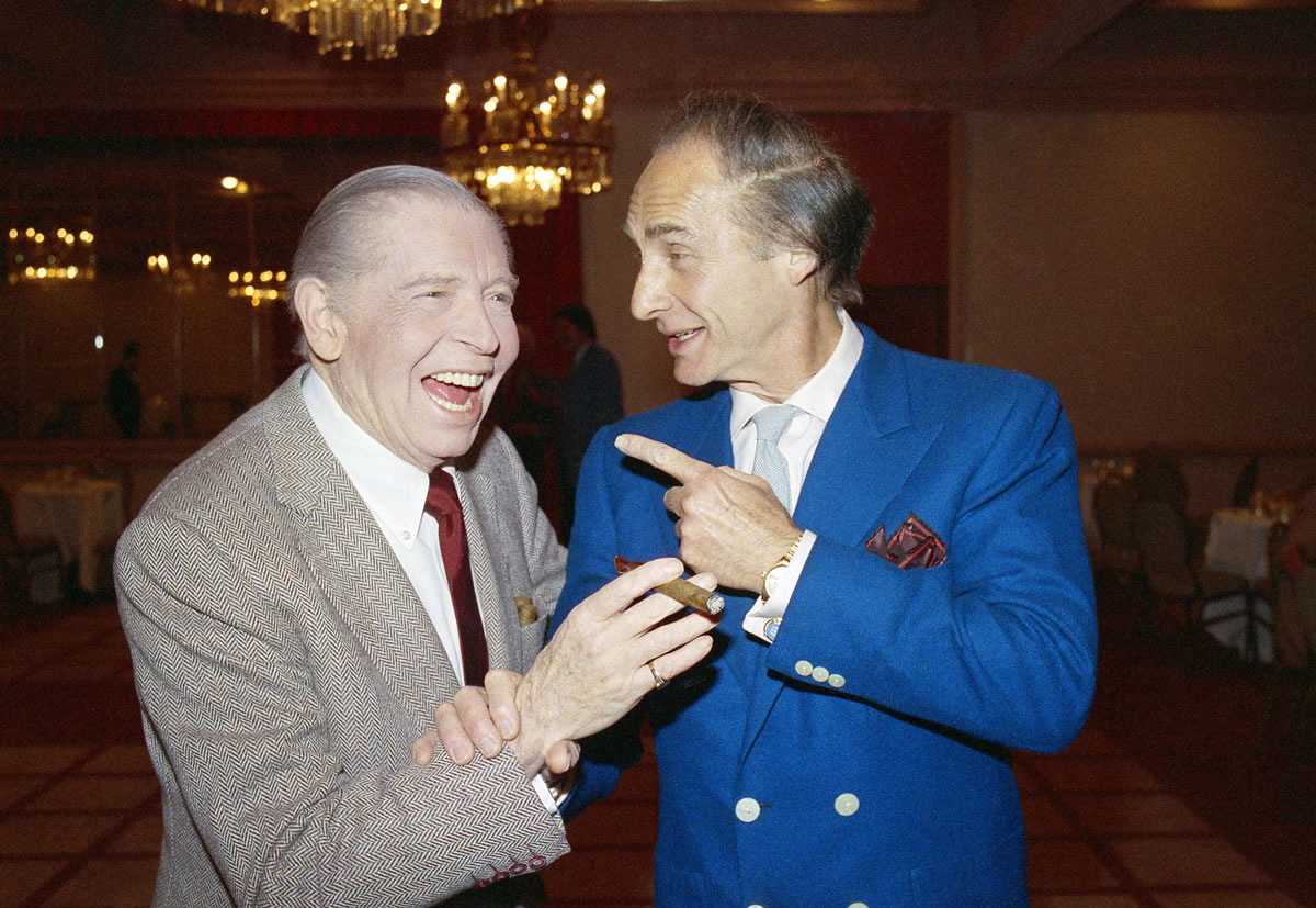 Comedians Milton Berle, left, and Sid Caesar prior to Caesar's roast in 1986 in Beverly Hills, Calif. Caesar, whose sketches lit up 1950s television with zany humor, died Wednesday.