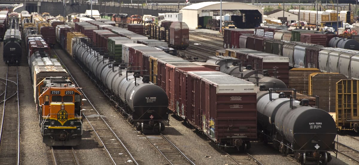 Black tank cars used to transport crude oil from North Dakota are parked among other rail traffic June 20 at a train yard in Tacoma.