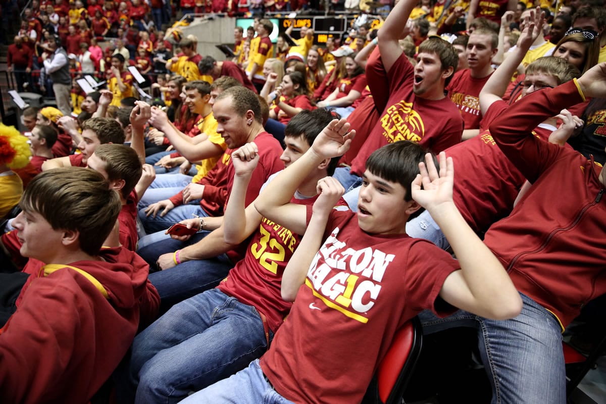 Fans in the Iowa State student section all flop as Oklahoma State's Marcus Smart is introduced Saturday.