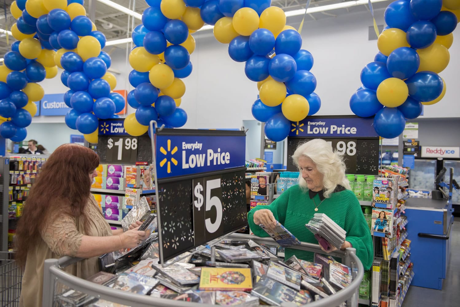 Bobbi Pratt of Orchards, left, sifts through the variety of discounted movies with her mom, Bernice Hayes, also of Orchards on Sept. 23 at the new Wal-Mart.