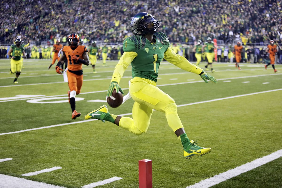 Oregon receiver Josh Huff leaps into the end zone after a reception and sideline run during the first half in Eugene, Ore.