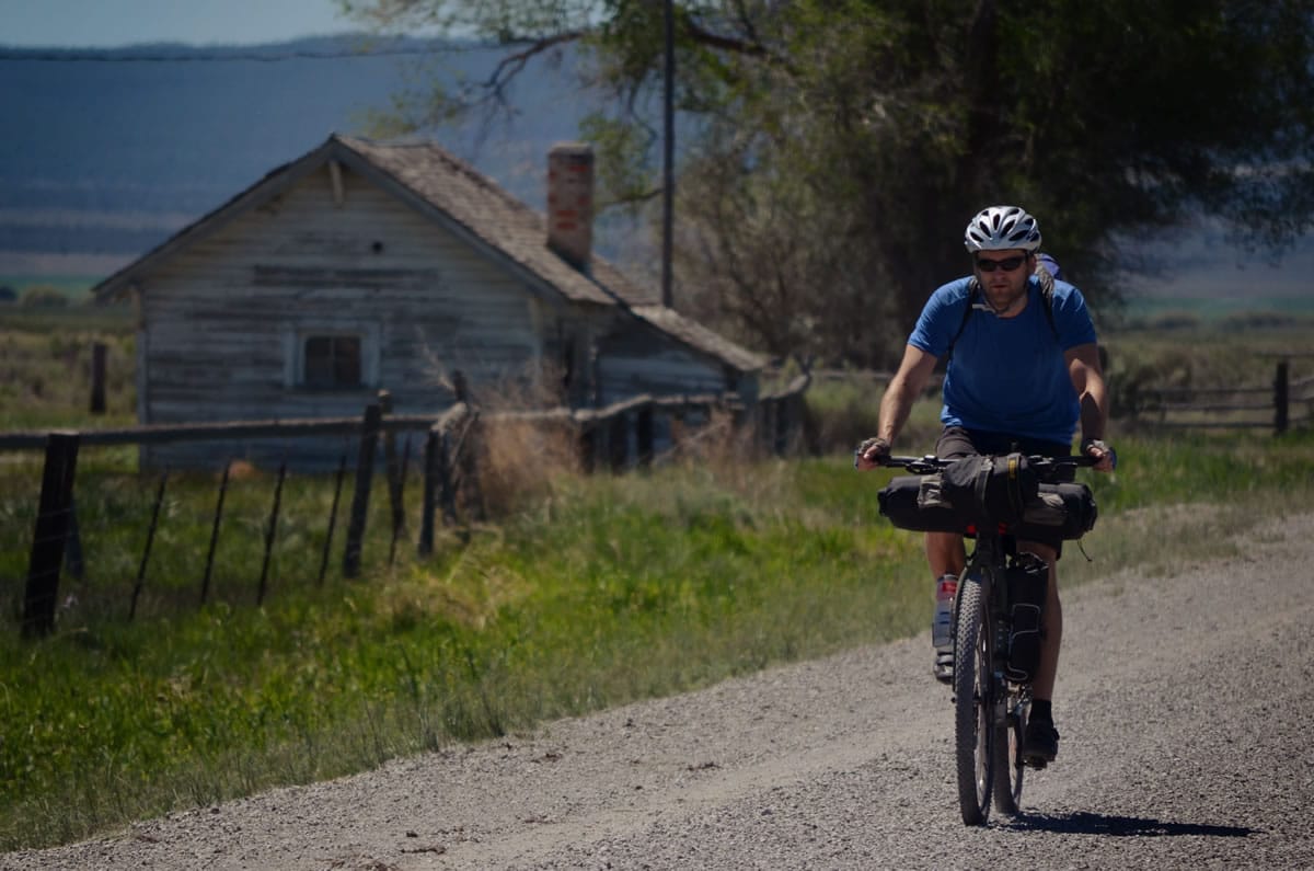 Donnie Kolb pedals down a gravel road near Silver Lake, Ore., in June. Kolb has been organizing gravel bicycle rides for the past five years, usually keeping his events a bit on the down-low.