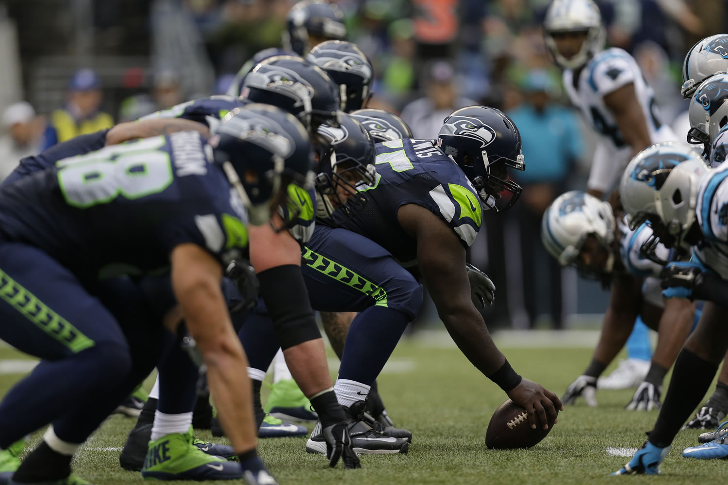 Seattle Seahawks center Patrick Lewis gets set to snap the ball on the line of scrimmage against the Carolina Panthers in the second half of an NFL football game, Sunday, Oct. 18, 2015, in Seattle.