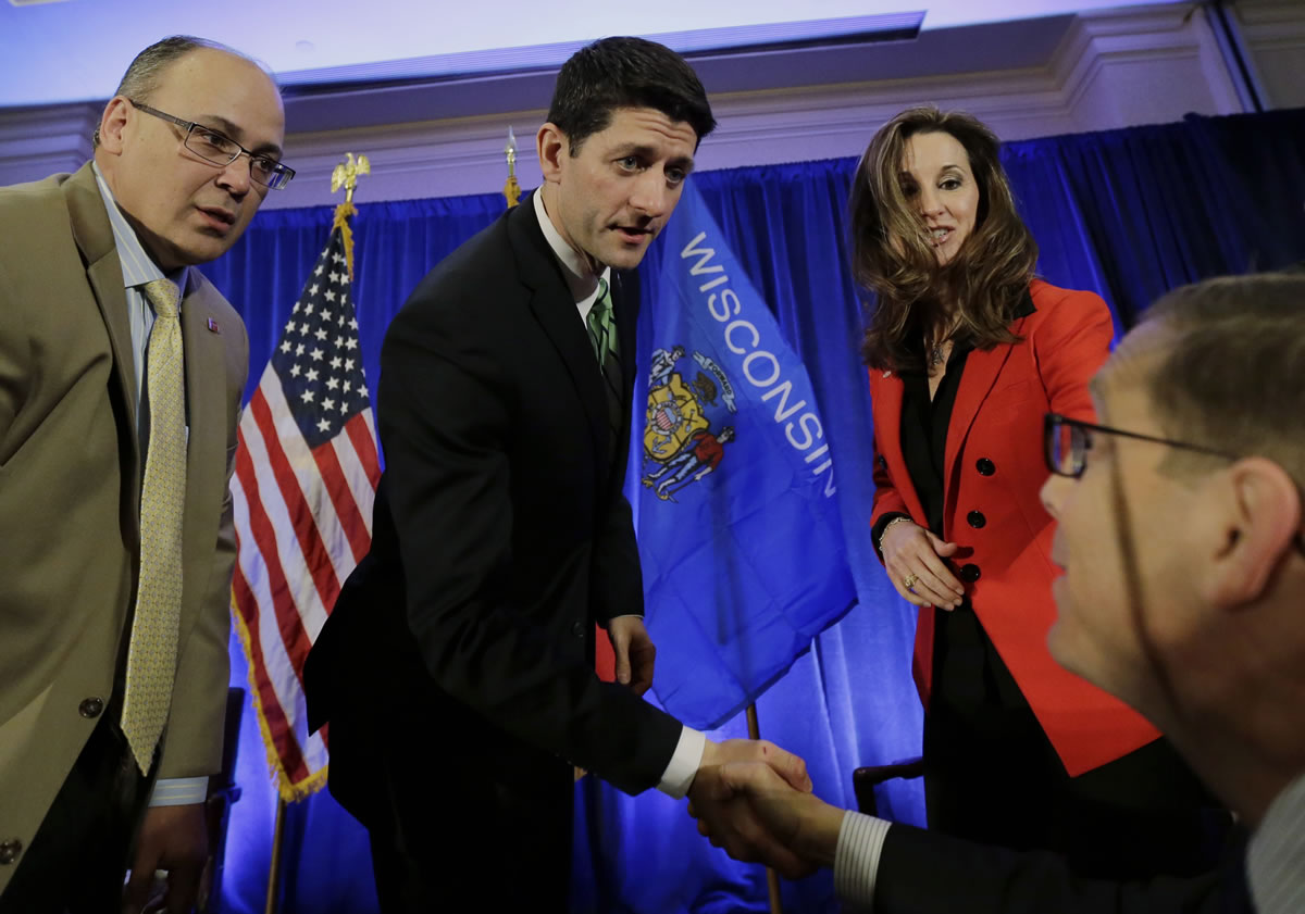 House Budget Committee Chairman Rep. Paul Ryan, center, shakes hands with attendees during a San Antonio Hispanic Chamber of Commerce event, Thursday in San Antonio.