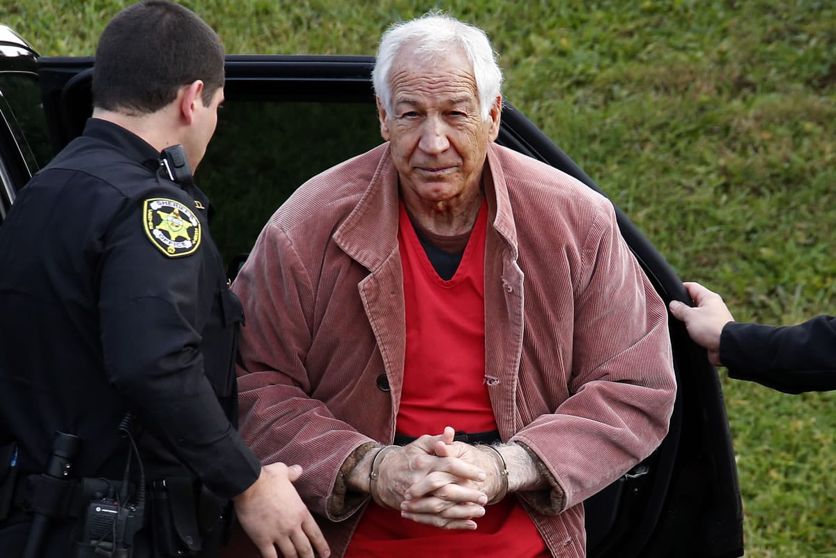 FILE - In this Oct. 29, 2015, file photo, former Penn State University assistant football coach Jerry Sandusky arrives at the Centre County Courthouse for an appeal hearing in Bellefonte, Pa. The university?s audited financial statements dated Oct. 30, 2015, for the year that ended June 30, show that Penn State settled with six more of Sandusky&#039;s victims or accusers for $33.2 million in new payments over claims. According to the audit, that puts the school?s total payout at nearly $93 million. (AP Photo/Gene J.