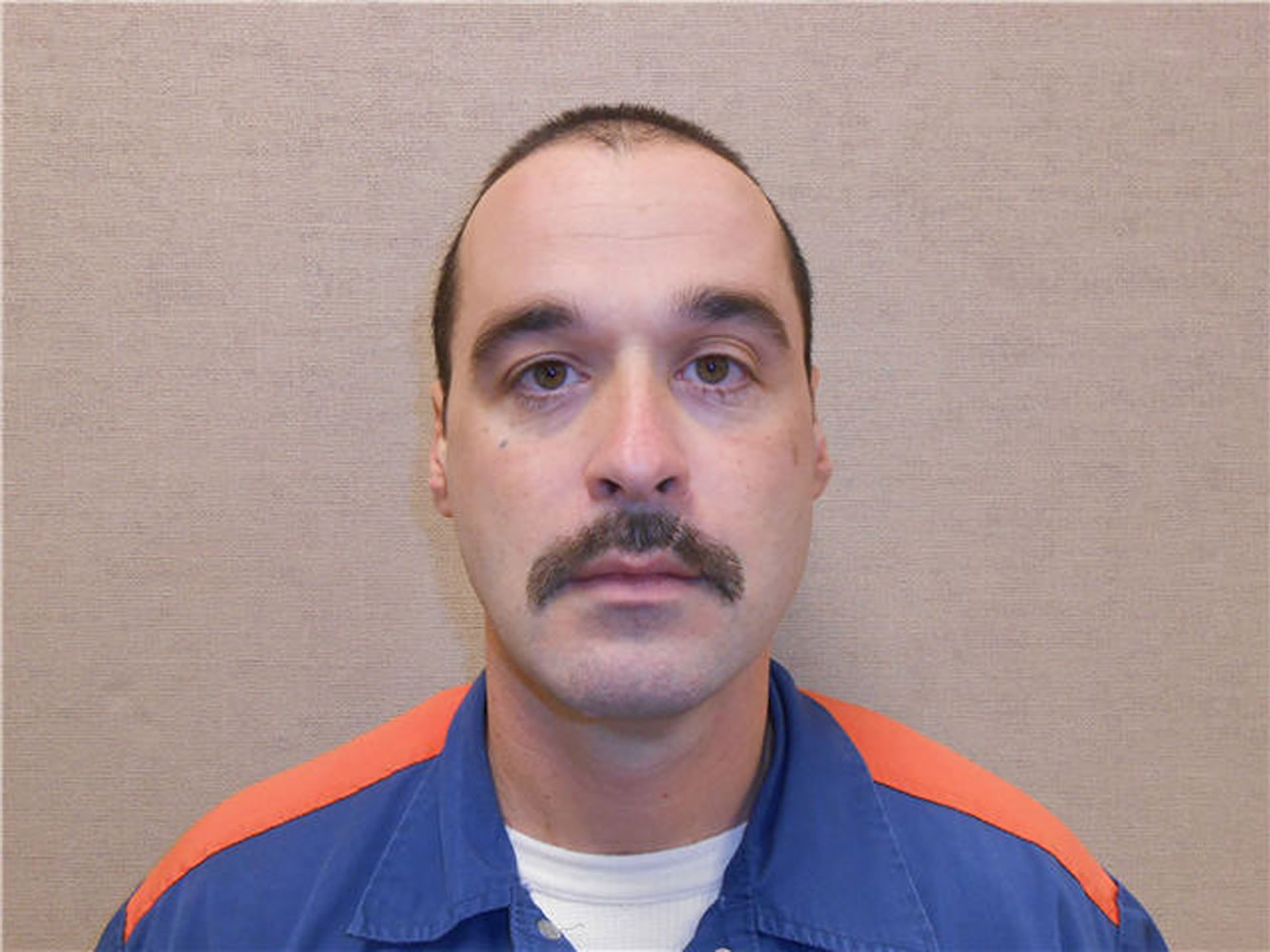 Michael David Elliot is serving life behind bars for murder in four 1993 deaths in Michigan.