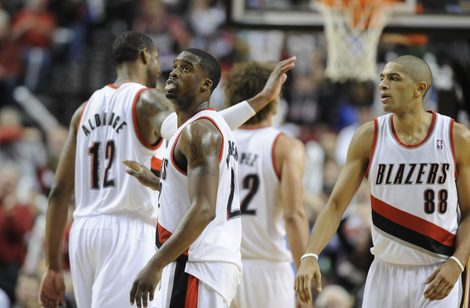 Portland Trail Blazers'  Wesley Matthews, center, celebrates a three point shot during the second half Thursday against the Houston Rockets.