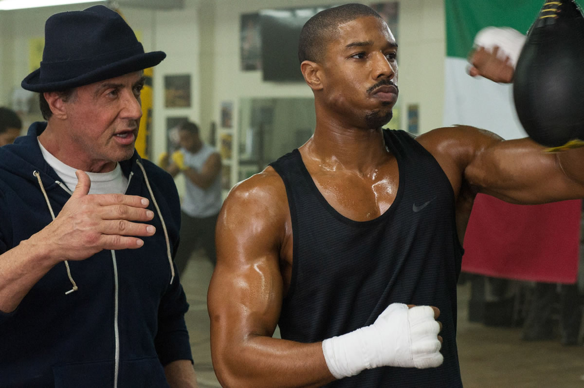 Rocky Balboa (Sylvester Stallone), left, trains Adonis Johnson (Michael B. Jordan) in &quot;Creed.&quot; (Barry Wetcher/Warner Bros.