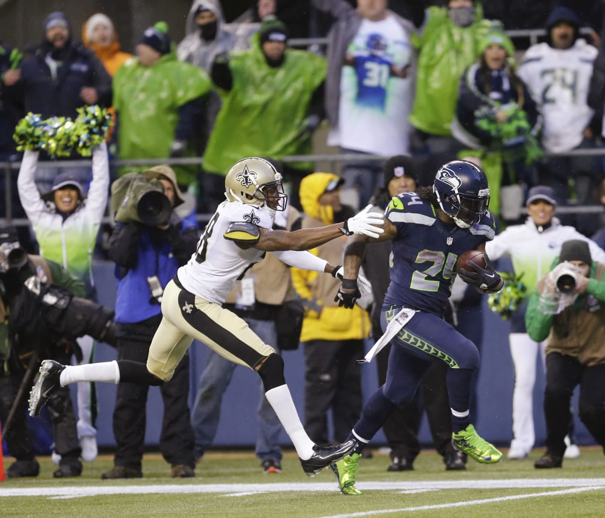 Seattle Seahawks running back Marshawn Lynch (24) runs past New Orleans Saints cornerback Keenan Lewis (28) to score on a 31-yard touchdown during the fourth quarter Saturday. (AP Photo/Ted S.