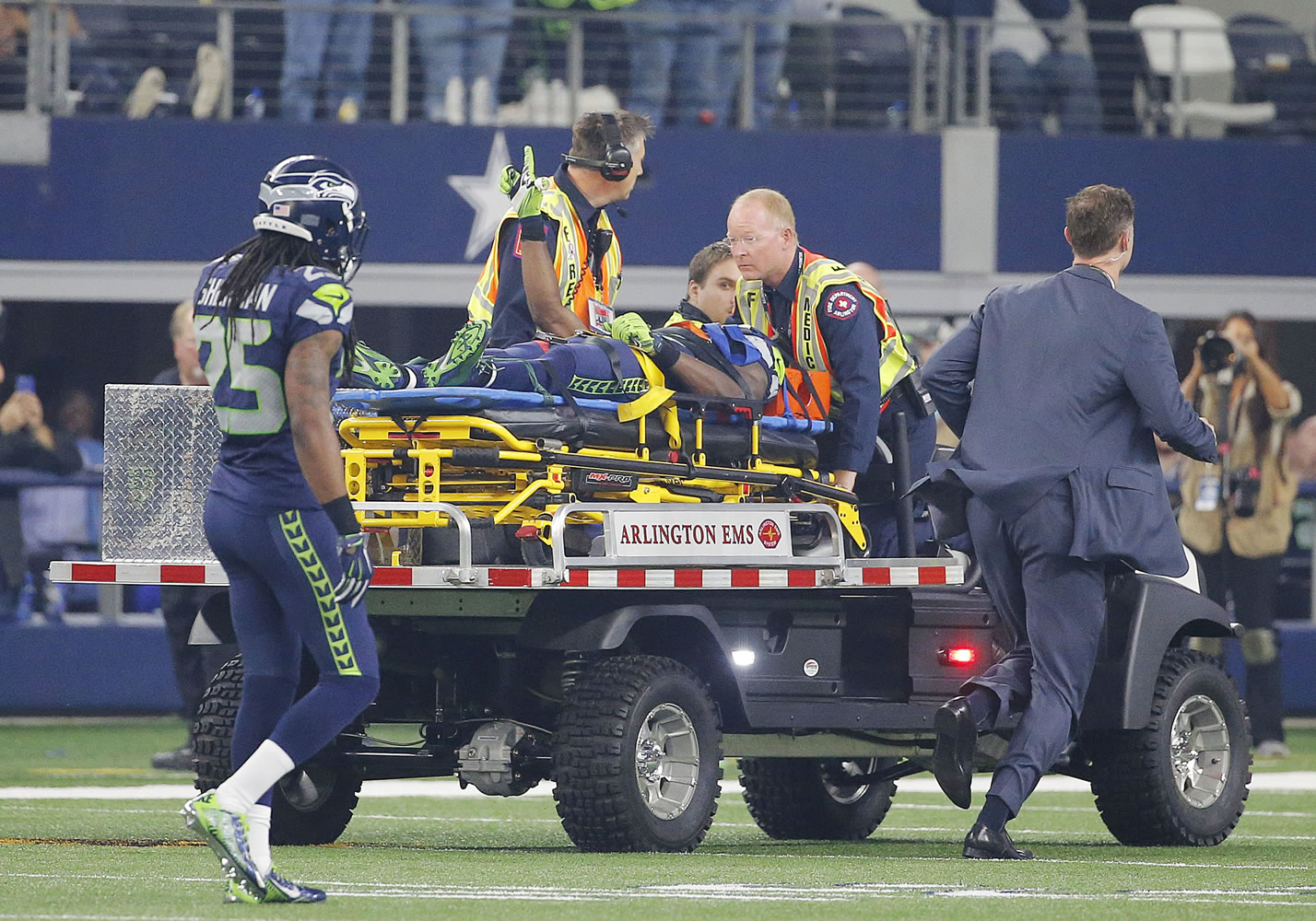 Seattle Seahawks wide receiver Ricardo Lockette (83) is carted off the field after suffering a concussion during an NFL football game against the Dallas Cowboys Sunday, Nov. 1, 2015, in Arlington, Texas.