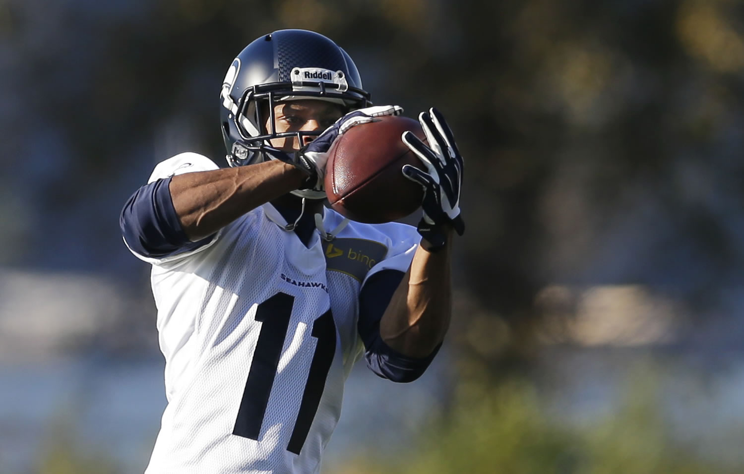 Seattle Seahawks wide receiver Percy Harvin makes a catch as he takes part in an NFL football practice, Tuesday, Oct. 22, 2013, in Renton, Wash. It was Harvin's first full team practice since he injured his hip during the off-season. (AP Photo/Ted S.