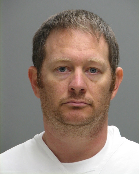 This booking photo provided by the Delaware Department of Justice shows Lee Robert Moore. Federal authorities say Moore, a Secret Service agent from Maryland, sent obscene images and texts to someone he thought was a young Delaware girl, sometimes doing it while on duty at the White House.