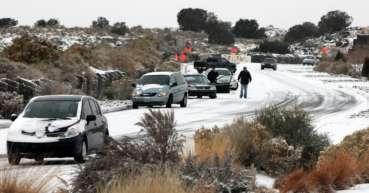 Cars slide on Paseo del Norte on Sunday in Albuquerque, N.M., after a winter storm hit New Mexico over the weekend making driving difficult for drivers.
