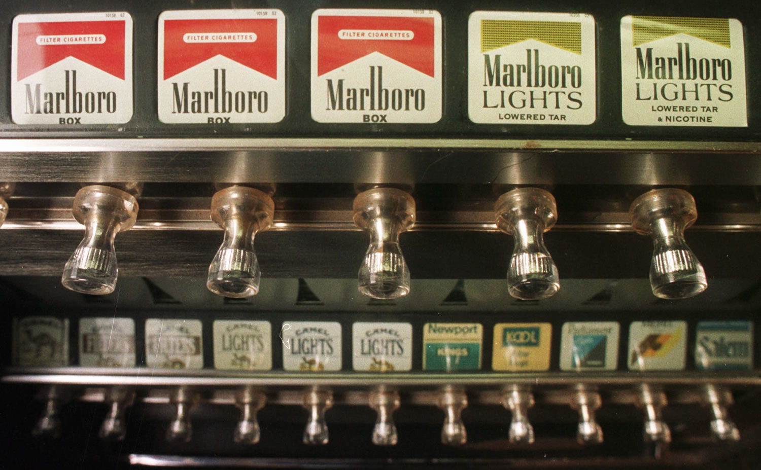 A cigarette vending machine in a bar in Montpelier, Vt., in October 1997. A law passed by the Legislature banned all cigarette vending machines in the state as of Aug.