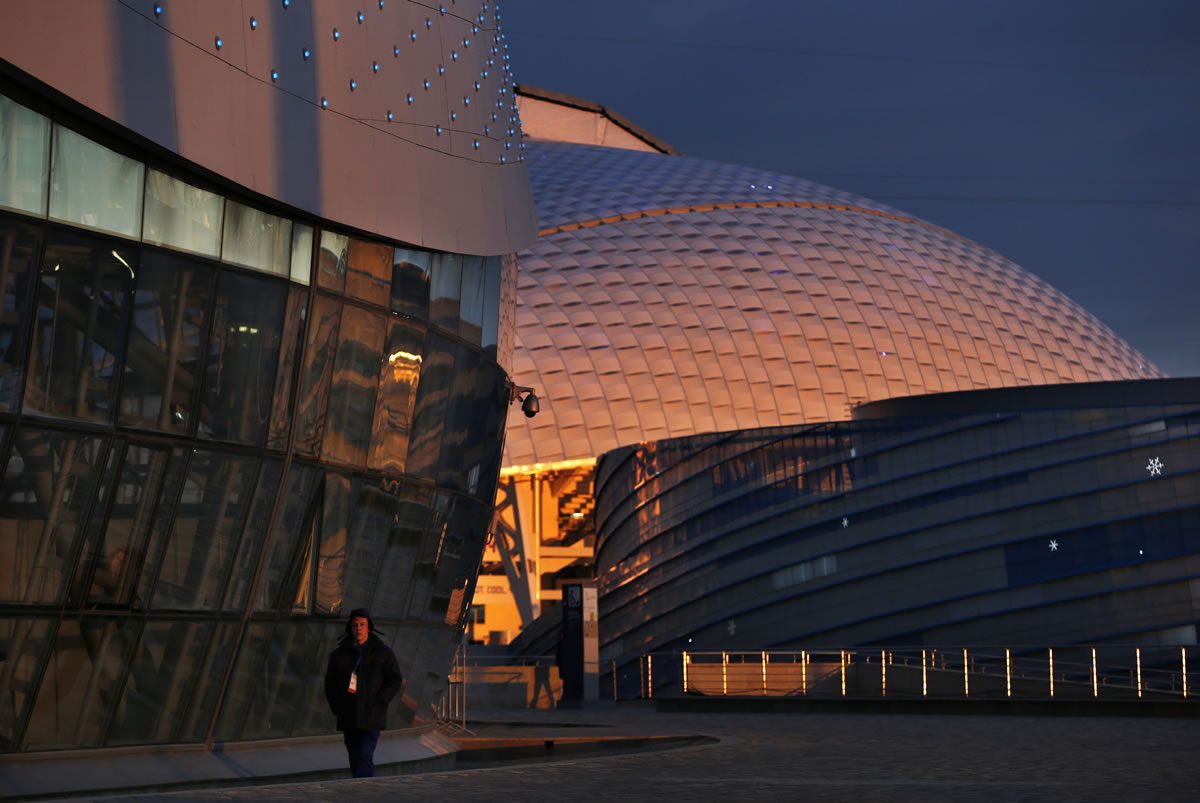 The Bolshoy Ice Dome, left, Fisht Olympic Stadium, center, and the Shayba Arena are seen at sunset one day before the start of the of the the 2014 Winter Olympics, Thursday, Feb. 6, 2014, in Sochi, Russia. (AP Photo/Robert F.