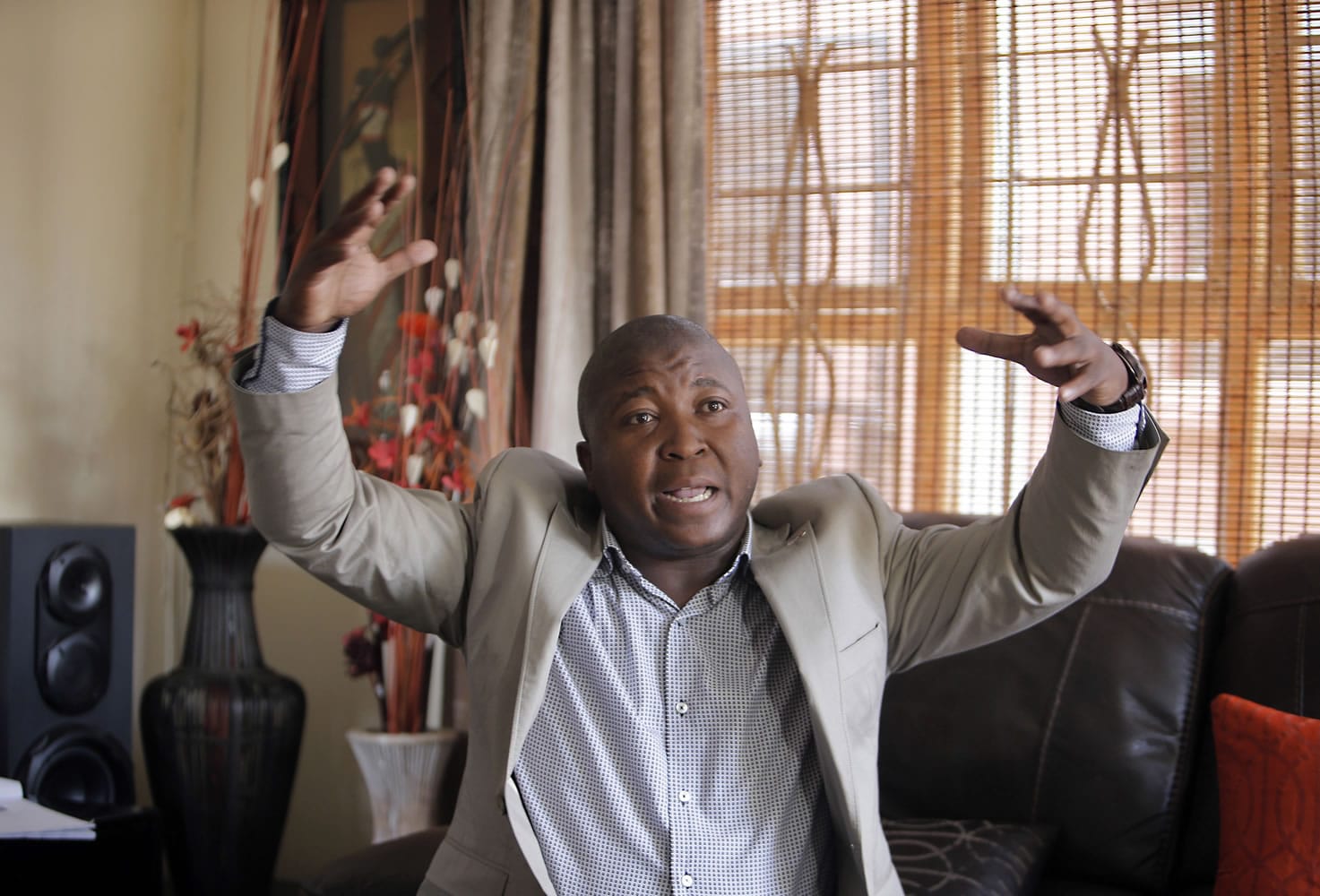 Thamsanqa Jantjie gesticulates at his home during an interview with the Associated Press in Johannesburg, South Africa,on Thursday.