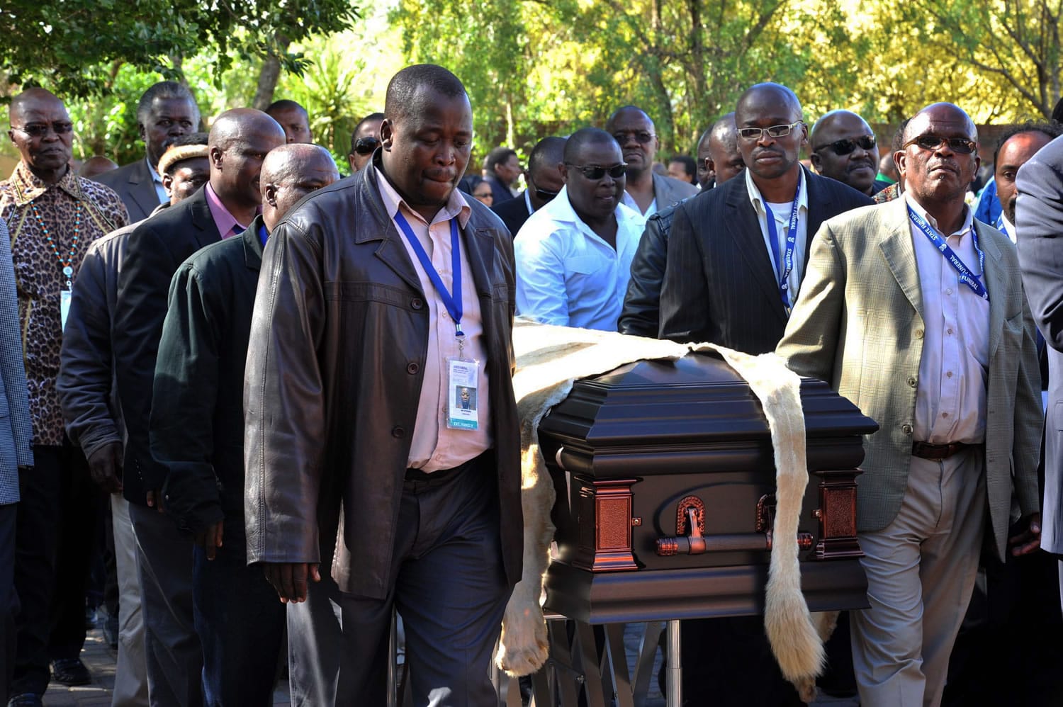 Local chiefs escort the lion-skin-draped casket of former South African President Nelson Mandela as it arrives Saturday at the Mandela residence in Qunu, South Africa.