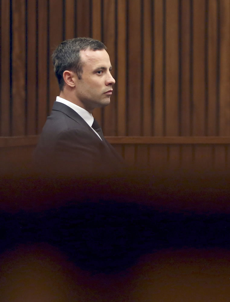 Oscar Pistorius listens to cross questioning during his trial Friday at the high court in Pretoria, South Africa.